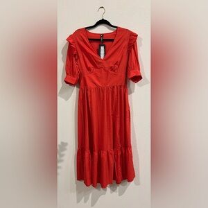 Dainty red dress with black mini hearts and ruffles on sleeves